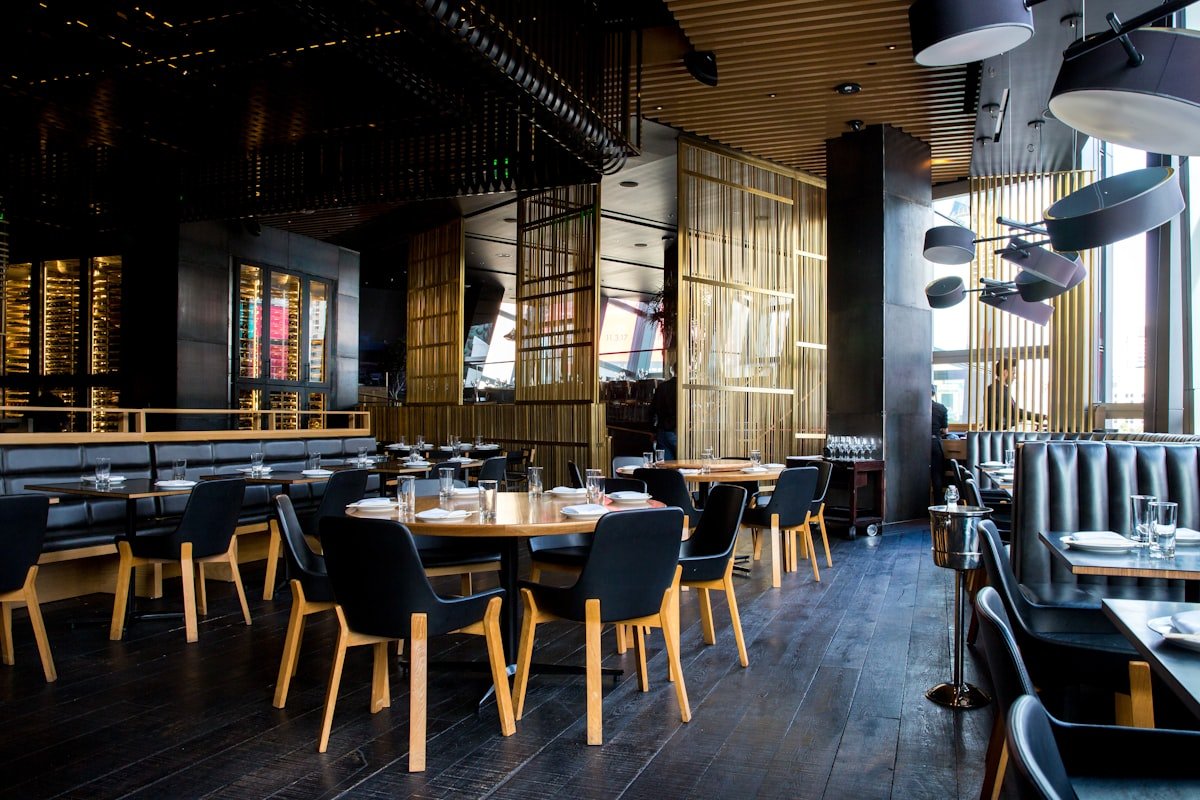 Restaurant dining room with warm lighting and guests